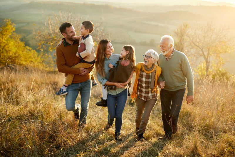generational family walking considering a donor-advised fund vs. private foundation